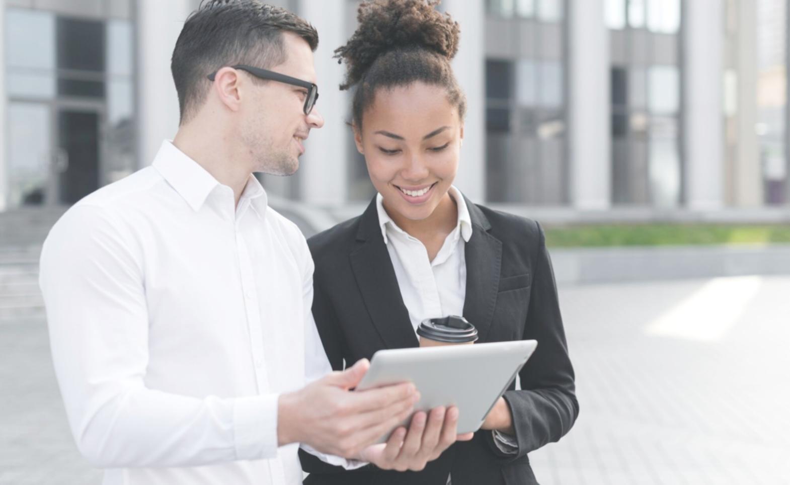 Business professionals reviewing partnership agreements